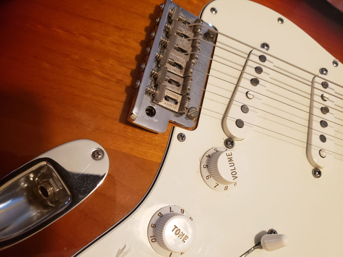 photo of a guitar closeup